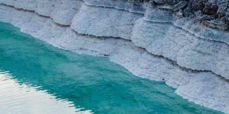 Salty River Of Blue Water At Sunset Near Mountains